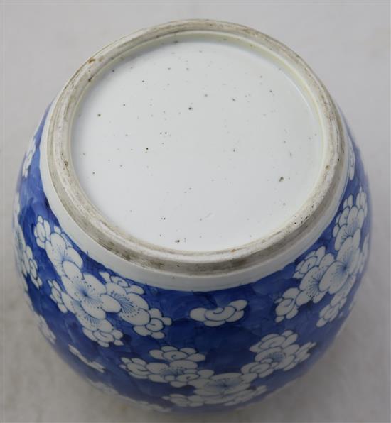 A Chinese blue and white ovoid jar, 18th century, height 21.5cm, wood stand